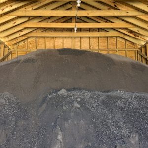 Black pulverized dirt. Photo of the dirt in a Steve Miller Inc warehouse.