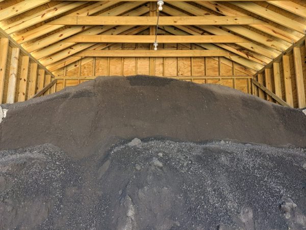 Black pulverized dirt. Photo of the dirt in a Steve Miller Inc warehouse.